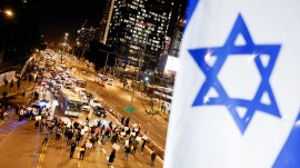 Demonstrators block traffic during a protest calling for the release of hostages kidnapped in the deadly October 7 attack on Israel by the Palestinian Islamist group Hamas from Gaza, in Tel Aviv, Israel March 4, 2024. REUTERS/Carlos Garcia Rawlins TPX IMAGES OF THE DAY