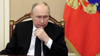 Russian President Vladimir Putin chairs a meeting, held via video link to discuss aftermaths and measures taken after the attack on the Crocus City Hall concert venue, outside Moscow, Russia, March 25, 2024. (Sputnik/Mikhail Metzel/Pool via Reuters)