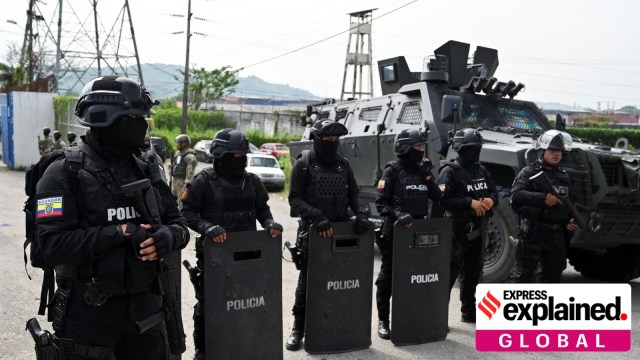 Police officers stand guard as Ecuador's former Vice President Jorge Glas is expected to arrive at the La Roca Prison in Ecuador.