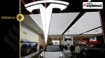 Visitors check a Tesla Model 3 car next to a Model Y displayed at a showroom of the U.S. electric vehicle (EV) maker in Beijing, China February 4, 2023.