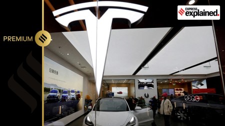 Visitors check a Tesla Model 3 car next to a Model Y displayed at a showroom of the U.S. electric vehicle (EV) maker in Beijing, China February 4, 2023.