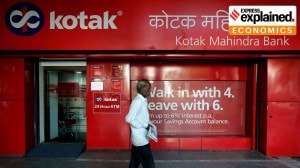 A man walks past the Kotak Mahindra Bank branch in New Delhi