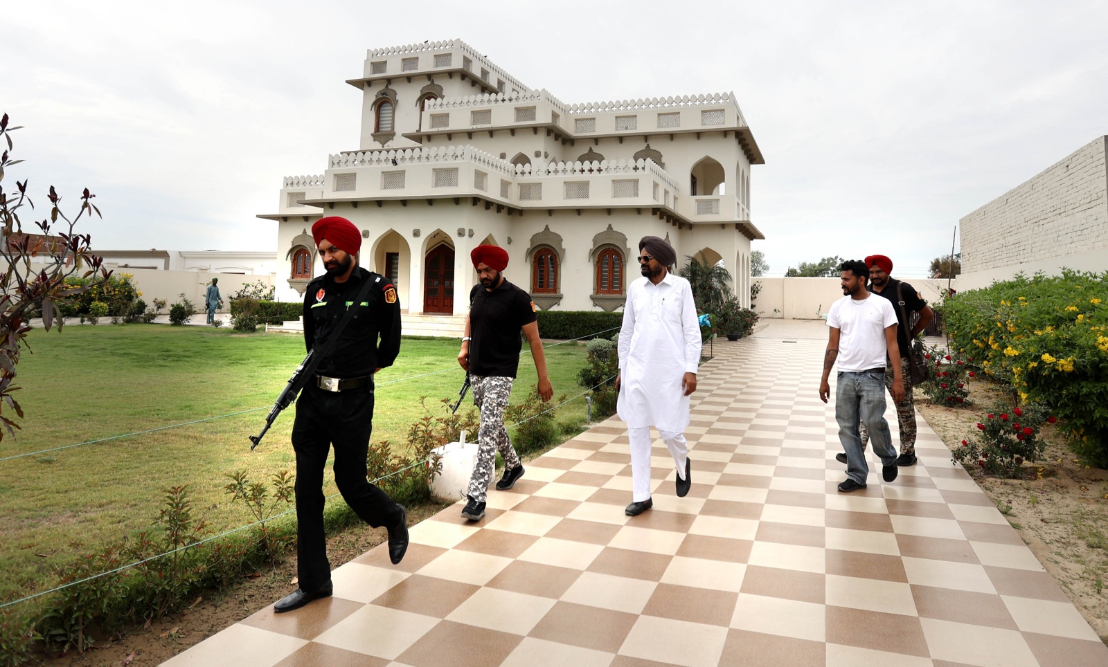 Sidhu Moosewala's father Balkaur Singh moves under heavy security even inside the house . (Express Photo by Gurmeet Singh)