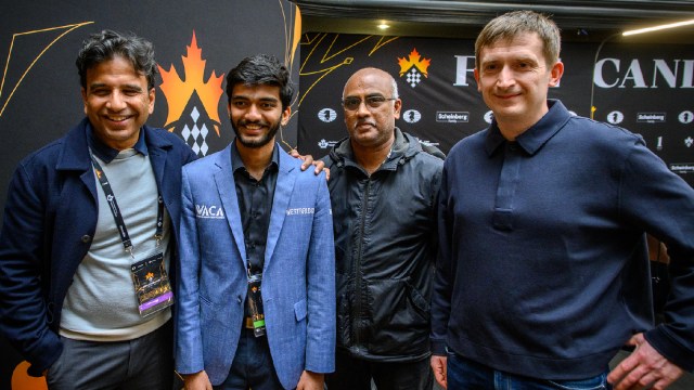 Gukesh poses with his team after winning the Candidates, including his father Dr Rajinikanth 9second from right) and his trainer Grzegorz Gajewski (right). (PHOTO: Michal Walusza/FIDE)