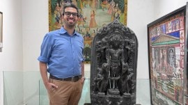 Malcolm F Todywalla with an 11th century Pala Stele depicting Vishnu, Bengal