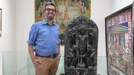 Malcolm F Todywalla with an 11th century Pala Stele depicting Vishnu, Bengal