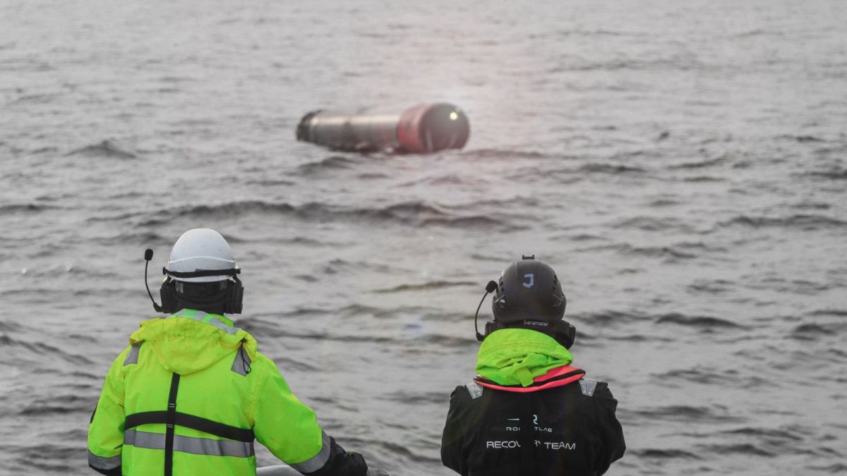 Technicians recovering a Rocket Lab launch vehicle from the sea. (Rocket Lab)