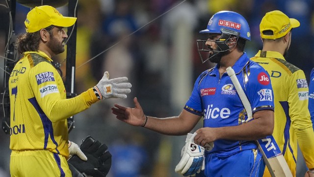 Chennai Super Kings player MS Dhoni and Mumbai Indians player Rohit Sharma greet each other at the end of the Indian Premier League (IPL) cricket match between Chennai Super Kings and Mumbai Indians, at Wankhede Stadium in Mumbai,