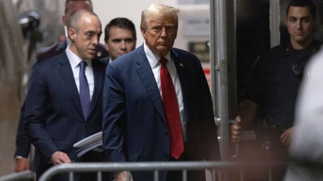 Former President Donald Trump returns from a break at Manhattan criminal court in New York,