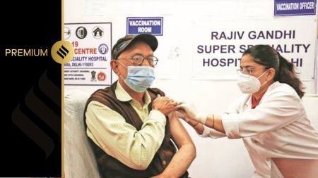 A medical worker inoculates an elderly man with a Covid-19 coronavirus vaccine at Rajiv Gandhi Super Speciality Hospital in Delhi. (Express Photo by Praveen Khanna)