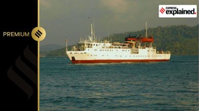 Ship on water, island visible in the background.
