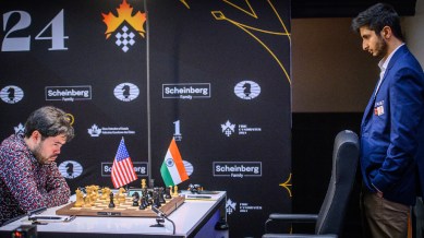 Candidates chess 2024: Vidit Gujrathi watches his opponent Hikaru Nakamura contemplate his next move in their second round match at the Candidates chess tournament. (PHOTO: FIDE/Michal Walusza)
