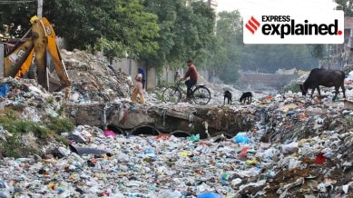 A drain filled with plastic waste in Taimur Nagar, in New Delhi in 2023.