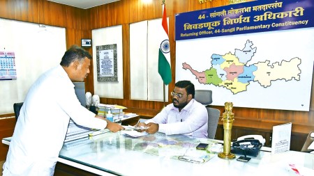 Vishal Patil filing his nomination papers in Sangli on Monday. (Express Photo)