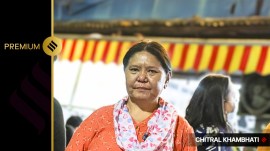 Dolma Tshering, owner of 'Dolma Aunty Momos', stand near her food stall at Lajpat Nagar in New Delhi. (Express photo by Chitral Khambhati)