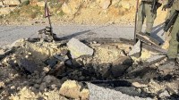 A view of a crater on a damaged road, after Iran's mass drone and missile attack, at a location given as Hermon area, Israel, in this handout picture released on April 14, 2024. Israel Defense Forces/Handout via REUTERS THIS IMAGE HAS BEEN SUPPLIED BY A THIRD PARTY
