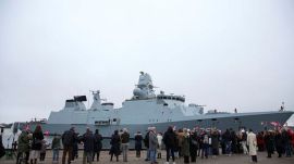 Families of crew members wait as the Danish naval frigate Iver Huitfeldt returns after a deployment to the Red Sea to its base in Korsor, Denmark