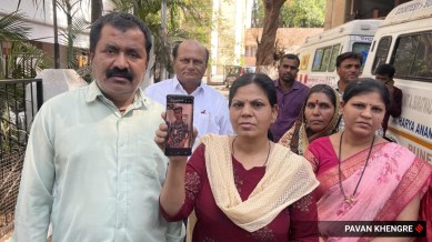 Gopal govind Karad and Savita Gopal Karad showing Pranav Karad’s Image