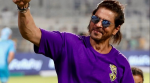 Following Kolkata Knight Riders' victory, Shah Rukh Khan was spotted collecting the fallen flags of his team, sporting his team's jersey and a small ponytail