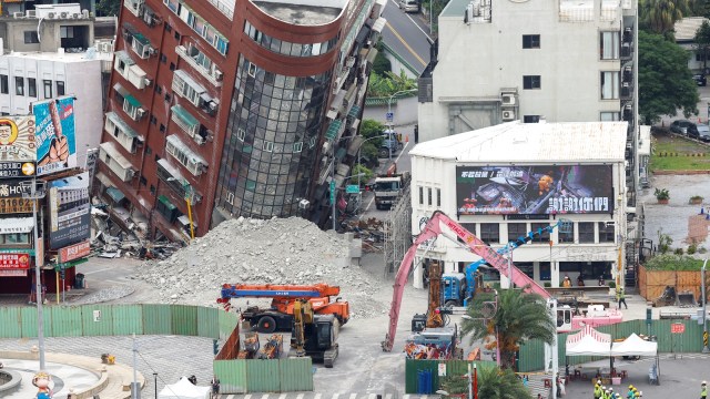 People take part in a ceremony ahead of the demolition of a damaged building, following the earthquake, in Hualien, Taiwan, April 5, 2024. (Reuters)