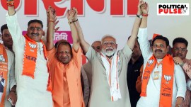 PM Narendra Modi and Uttar Pradesh CM Yogi Adityanath with party candidates in Aligarh on Monday. (ANI)