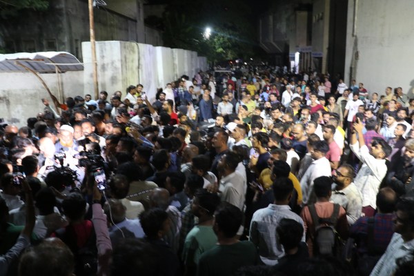 People gather outside the Rajkot Civil Hospital where injured people were brought for treatment and bodies for examination. (Photo: Express)