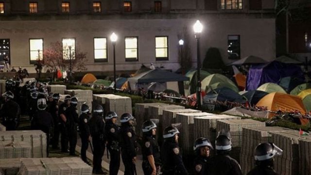 Protesters face off with NYPD law enforcement officials holding a perimeter of closed streets surrounding Columbia University during a comprehensive operation to clear campus of students protesting in support of Palestinians on campus, during the ongoing conflict between Israel and the Palestinian Islamist group Hamas. (Reuters Photo)