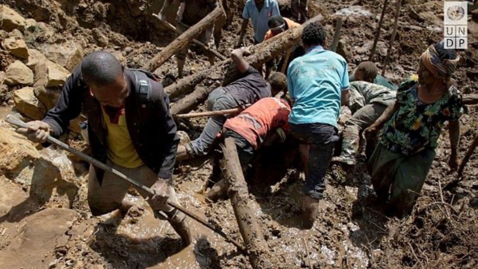 People clear an area at the site of a landslide in Yambali village, Enga Province, Papua New Guinea. (Reuters)