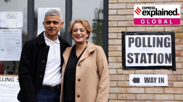 Mayor of London Sadiq Khan and his wife Saadiya Khan stand outside a polling station during local elections in London, Britain May 2, 2024.