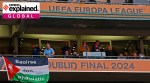 A Palestine flag with a Liverpool emblem and message is displayed before the Europa League final match.