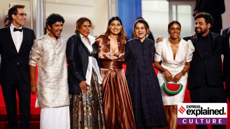 Actor Kani Kusruti (second from right) posing with a watermelon clutch while arriving for the screening of ‘All We Imagine As Light’ at the Cannes Film Festival. She can be seen with the cast and crew of the fim. (Reuters/Sarah Meyssonnier)