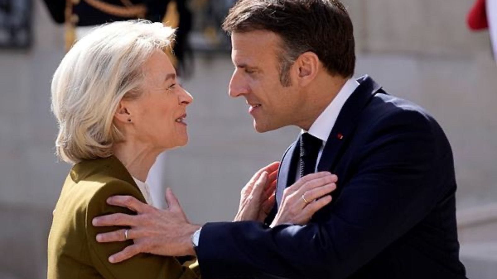 French President Emmanuel Macron hugs the president of the European Commission Ursula von der Leyen before their talks with China's President Xi Jinping, at the Elysee Palace.