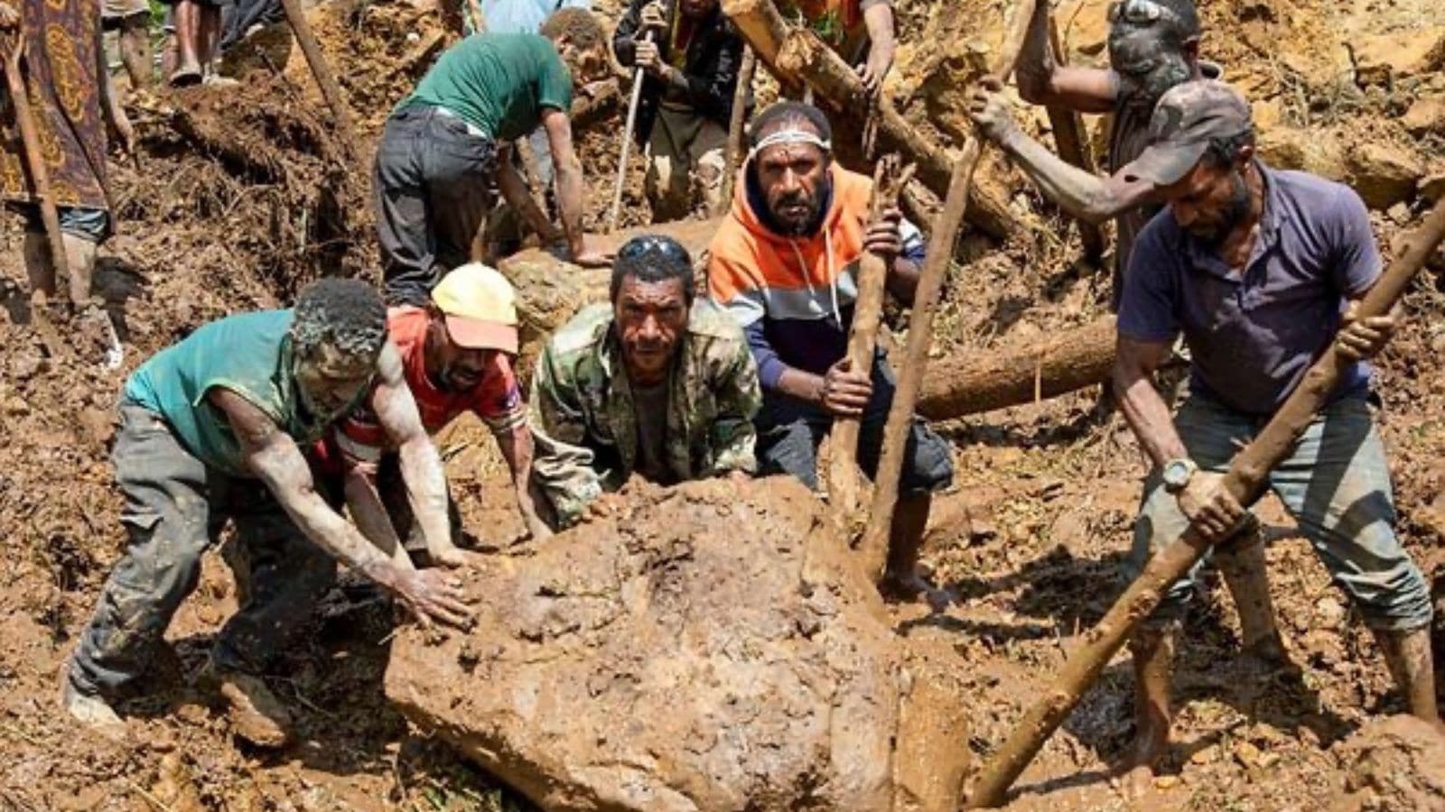 In this photo released by UNDP Papua New Guinea, villagers search through a landslide in Yambali village. (AP)