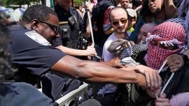 Police struggle with demonstrators and student activists after protesters hung a giant Palestinian flag at a protest encampment in support of Palestinians at George Washington university. (Photo by Reuters)