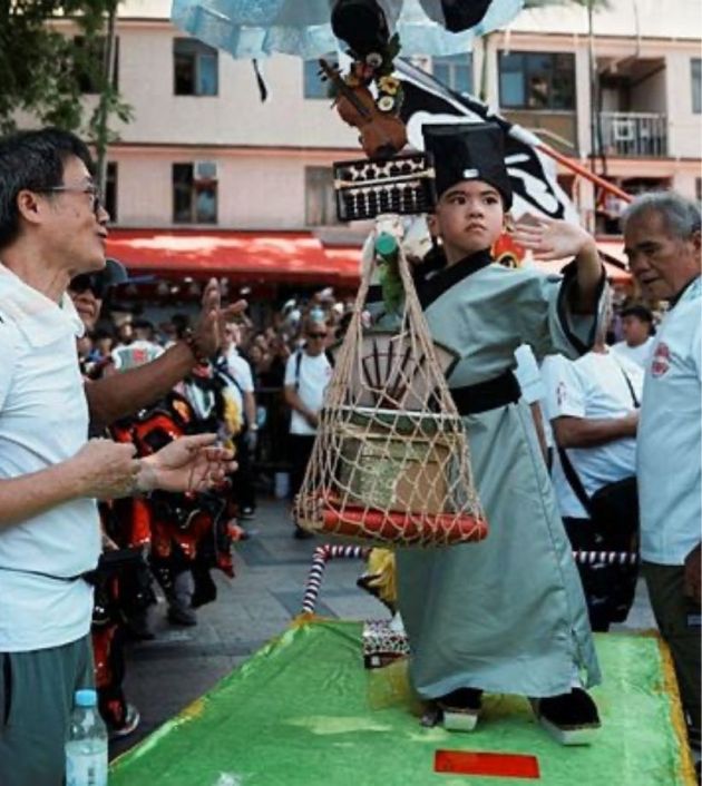 Visitors packed the tiny island of Cheung Chau to watch children parade in costumes and to eat buns stamped with the Chinese characters for 'peace' and 'safety'.