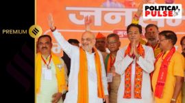 Union Home Minister Amit Shah with BJP candidate from Jhansi constituency Anurag Sharma and others during a public meeting for the Lok Sabha elections, in Lalitpur district. (PTI)