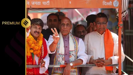 Union Defence Minister Rajnath Singh holds a roadshow in support of BJP candidate from North East Delhi Manoj Tiwari ahead of the Lok Sabha polls, in New Delhi on Wednesday. (ANI Photo)