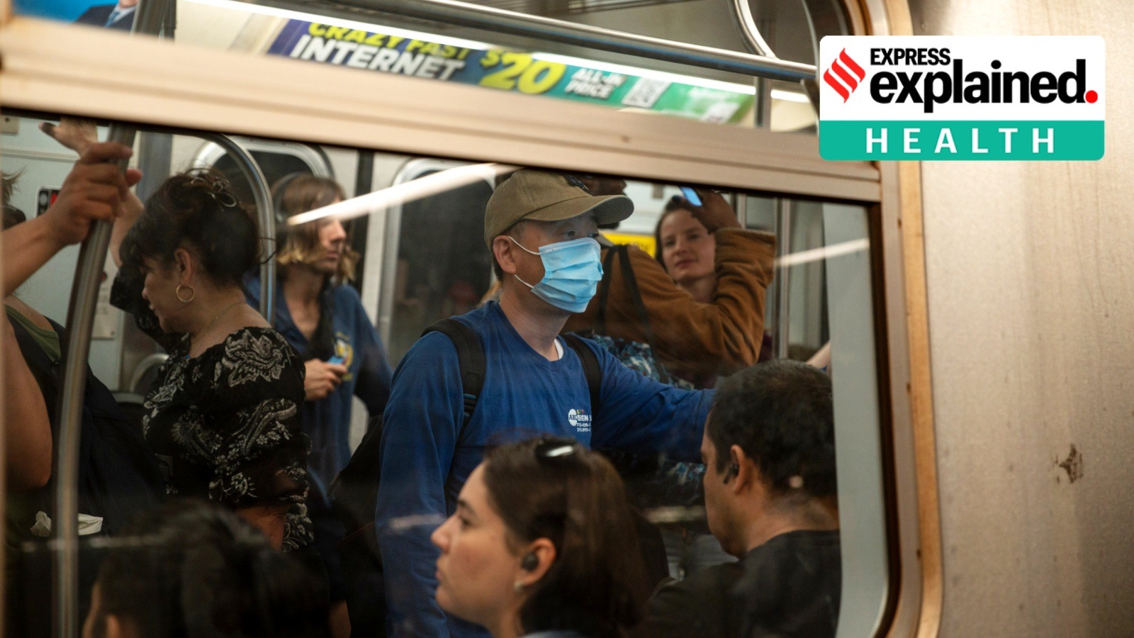A masked rider on a subway train at Union Square in Manhattan, May 11, 2023.