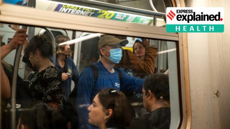 A masked rider on a subway train at Union Square in Manhattan, May 11, 2023.