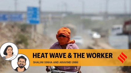A man rides his cycle near a landfill site on a hot summer day during a heatwave in New Delhi. (Reuters)