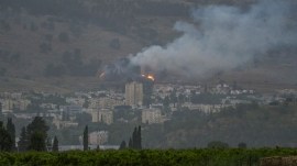 Smoke rises over the city of Kiryat Shmona following a rocket that was launched from Lebanon and fired towards Israel