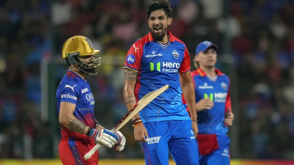 Delhi Capitals' Ishant Sharma celebrates the wicket of Royal Challengers Bengaluru's Virat Kohli during an Indian Premier League (IPL) 2024 T20 cricket match between Royal Challengers Bengaluru and Delhi Capitals, at the M Chinnaswamy Stadium, in Bengaluru, Sunday