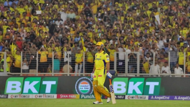 CSK's M S Dhoni walks out to bat during the IPL Cricket match between Gujarat Titans and Chennai Super Kings at Narendra Modi stadium, Ahmedabad on Friday. Express photo by Nirmal Harindran,