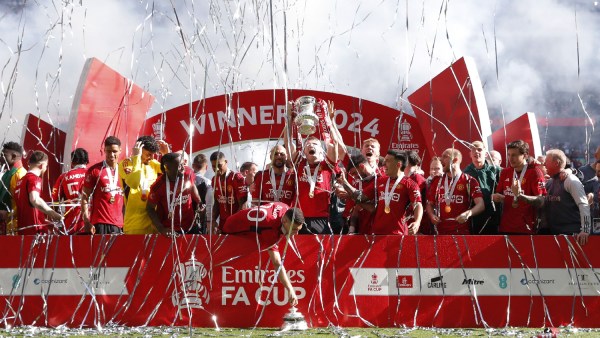  Manchester United's Scott McTominay celebrates with the trophy and teammates after winning the FA Cup 