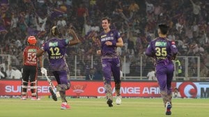 KKR's Mitchell Starc celebrates the wicket of Shahbaz Ahmed at the Narendra Modi Stadium in Ahmedabad. (Express photo by Nirmal Harindran)