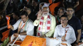 Prime Minister Narendra Modi during a roadshow in Kolkata on Tuesday. Partha Paul PM Modi targets Mamata, says TMC throttling judiciary in West Bengal, favours vote jihadi