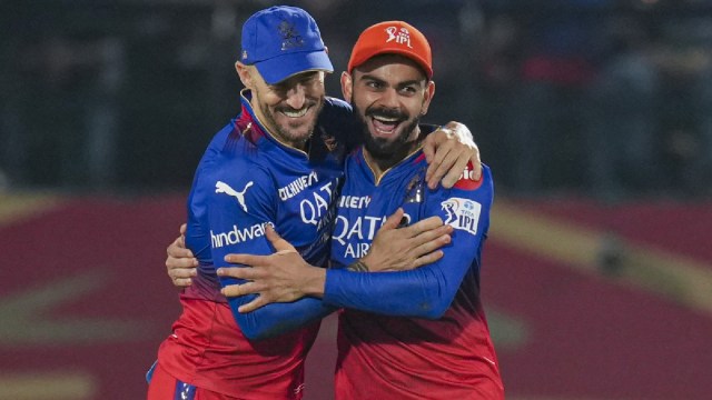 RCB playoffs scenarios: captain Faf du Plessis and Virat Kohli celebrate a Punjab Kings wicket.