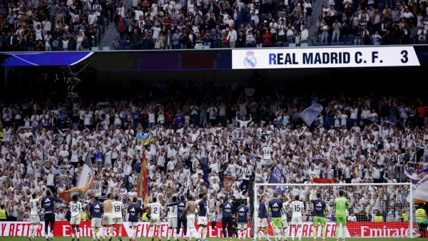 Real Madrid players celebrate with fans after the match. (Reuters)