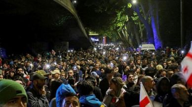 Demonstrators hold a rally to protest against a bill on "foreign agents" in Tbilisi, Georgi