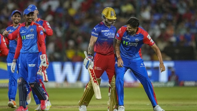 Delhi Capitals' Ishant Sharma celebrates the wicket of Royal Challengers Bengaluru's Virat Kohli during an Indian Premier League (IPL) 2024 T20 cricket match between Royal Challengers Bengaluru and Delhi Capitals, at the M Chinnaswamy Stadium, in Bengaluru